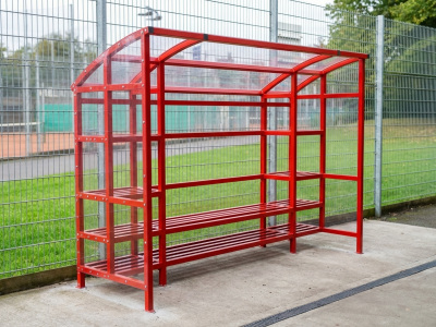 Durham team sports shelter with steel frame, polycarbonate sides, shelving and bench seating