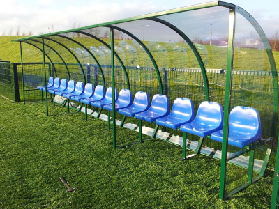 SS Sports Dugout - a team sports shelter with a steel frame, plastic seating and polycarbonate roof and sides.